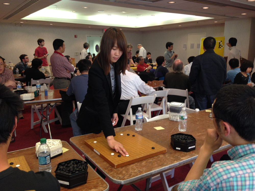 They setup the table to have four boards on each side so she could easily navigate back and forth.