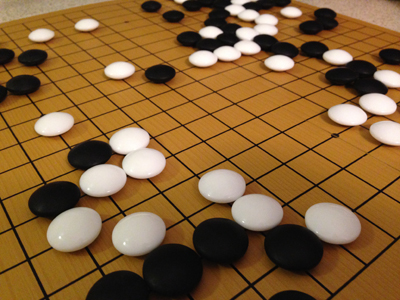 Folding go board in action with size 36 glass stones (close-up #1)