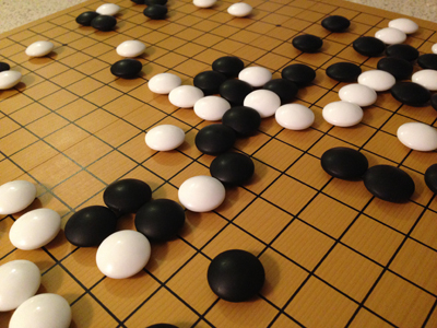 Folding go board in action with size 36 glass stones (close-up #2)