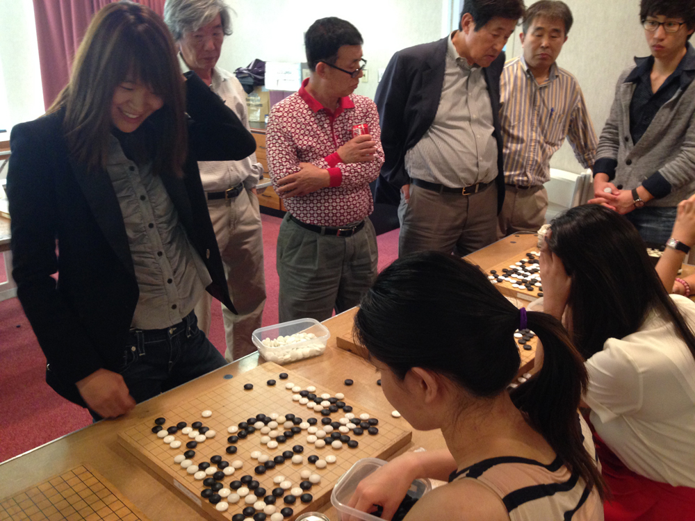 Here you can see Sohyun smiling as she analyzes the board position.