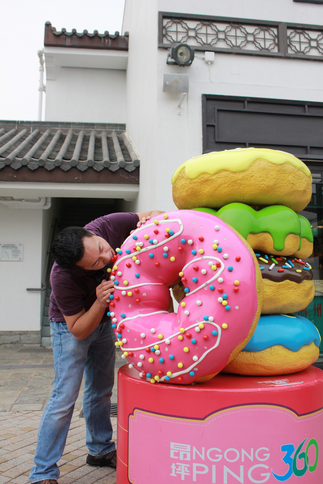 And finally, you have me being goofy and pretending to eat the large doughnut sculpture we found in the shopping district.